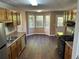 Spacious kitchen featuring wood cabinets, laminate countertops, and a gas range at 5942 King Way Walk, Lithonia, GA 30058