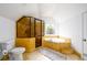 Bright bathroom features a glass shower, soaking tub, and a decorative window with stained glass at 1448 N Highland Ne Ave, Atlanta, GA 30306