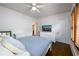 Bedroom with hardwood floors, a bed with soft pillows, a ceiling fan, and natural light at 1448 N Highland Ne Ave, Atlanta, GA 30306