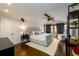 Spacious bedroom boasts a king-size bed, hardwood floors, and french doors with dark curtains at 1448 N Highland Ne Ave, Atlanta, GA 30306