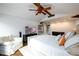 Bright and airy bedroom with a king-size bed, white chair, media cabinet and dark hardwood floors at 1448 N Highland Ne Ave, Atlanta, GA 30306
