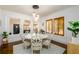 Bright dining room featuring a white round table with seating for six and a modern chandelier at 1448 N Highland Ne Ave, Atlanta, GA 30306