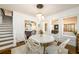 Bright dining room featuring a white round table with seating for six and a modern chandelier at 1448 N Highland Ne Ave, Atlanta, GA 30306
