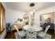 Bright dining room with round table, decorative chairs, and hanging pendant lights at 1448 N Highland Ne Ave, Atlanta, GA 30306