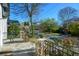 Covered front porch with stone pillars, iron railings, and view of the street at 1448 N Highland Ne Ave, Atlanta, GA 30306