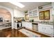 Classic kitchen features white cabinets, skylight, granite counters, and stainless steel appliances at 1448 N Highland Ne Ave, Atlanta, GA 30306