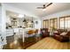 Open-concept living area featuring kitchen island, leather chairs, and natural light at 1448 N Highland Ne Ave, Atlanta, GA 30306
