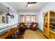 Cozy seating area in the living room with kitchen island and wood floors at 1448 N Highland Ne Ave, Atlanta, GA 30306