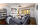 Bright living room featuring a large sectional sofa, decorative fireplace, and ample natural light at 1448 N Highland Ne Ave, Atlanta, GA 30306