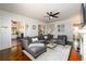 Inviting living room boasts a comfortable sectional sofa, fireplace, and seamless flow to other rooms at 1448 N Highland Ne Ave, Atlanta, GA 30306