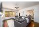 Cozy living room showcases a stylish sectional, fireplace, and access to the dining area at 1448 N Highland Ne Ave, Atlanta, GA 30306