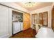 Dual-purpose office and laundry area featuring modern appliances and stylish barn door at 1448 N Highland Ne Ave, Atlanta, GA 30306