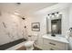 Modern bathroom featuring a marble shower, contemporary vanity, and stylish lighting at 510 Ponce De Leon Ne Mnr, Atlanta, GA 30307