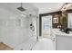 A luxurious bathroom with a spacious glass enclosed shower and double vanity at 969 Parsons Sw St, Atlanta, GA 30314