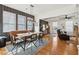 Elegant dining room with a stylish banquette, modern lighting, and hardwood floors at 969 Parsons Sw St, Atlanta, GA 30314