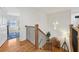Bright hallway with wood floors, iron railings, and modern decor at 969 Parsons Sw St, Atlanta, GA 30314