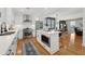 Open kitchen boasts white cabinets, stainless appliances and a large island at 969 Parsons Sw St, Atlanta, GA 30314