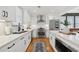 Bright kitchen featuring stainless steel appliances, a quartz countertop, and white cabinets at 969 Parsons Sw St, Atlanta, GA 30314