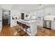Beautiful kitchen with white cabinets, an island and bar stools at 969 Parsons Sw St, Atlanta, GA 30314