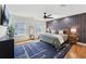 A spacious bedroom with a large bed, stylish rug, and ample natural light at 969 Parsons Sw St, Atlanta, GA 30314