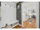 Hallway with built-in bench, hooks, wood floors and decor at 969 Parsons Sw St, Atlanta, GA 30314
