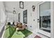 Inviting covered porch with stylish furniture and elegant black frame lighting at 969 Parsons Sw St, Atlanta, GA 30314