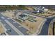 Aerial view of community amenities including bocce ball, pergolas, ample parking, and community gathering area at 5638 Maple Bluff Way, Hoschton, GA 30548
