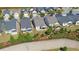 An elevated shot of multiple houses and landscaping, perfect for neighborhood showcasing at 5638 Maple Bluff Way, Hoschton, GA 30548