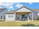 Lovely backyard featuring a cozy covered patio, ideal for relaxing and enjoying the peaceful outdoor space at 5638 Maple Bluff Way, Hoschton, GA 30548