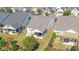Aerial view of a well-maintained backyard with a patio and outdoor seating area at 5638 Maple Bluff Way, Hoschton, GA 30548