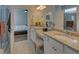 Bathroom with double vanity sinks, and a walk-in shower providing a refreshing escape at 5638 Maple Bluff Way, Hoschton, GA 30548