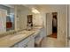 Bathroom featuring double sinks, and a walk-in shower for a spa-like experience at 5638 Maple Bluff Way, Hoschton, GA 30548