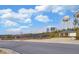 Community tennis courts and water towers visible from the street on a sunny day with fluffy clouds at 5638 Maple Bluff Way, Hoschton, GA 30548