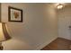 Welcoming hallway with hardwood floors, neutral paint, and ample lighting offers a warm entry at 5638 Maple Bluff Way, Hoschton, GA 30548