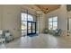 Well-lit lobby with floor to ceiling windows, an elegant chandelier, and comfortable seating at 5638 Maple Bluff Way, Hoschton, GA 30548