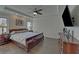 Elegant main bedroom features a tray ceiling, providing a luxurious and spacious retreat at 5638 Maple Bluff Way, Hoschton, GA 30548