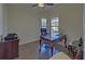 Home office with hardwood floors, large window, and classic furnishings at 5638 Maple Bluff Way, Hoschton, GA 30548
