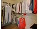 Organized walk-in closet with ample hanging and storage space for clothing and accessories at 5638 Maple Bluff Way, Hoschton, GA 30548
