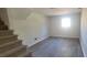 Finished basement area with carpeted stairs and vinyl floors at 1 Hidden Valley Dr, Lawrenceville, GA 30044