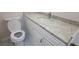 Beautiful bathroom with granite countertops, modern toilet, and marble flooring at 1 Hidden Valley Dr, Lawrenceville, GA 30044