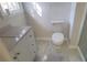 Renovated bathroom with marble floors, granite counters, and modern white toilet at 1 Hidden Valley Dr, Lawrenceville, GA 30044