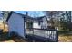 Spacious deck perfect for outdoor relaxation and entertaining, with a view of the lush backyard at 1 Hidden Valley Dr, Lawrenceville, GA 30044