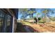 A stone walkway leading to a home entrance, surrounded by mature trees and a well-kept lawn at 1 Hidden Valley Dr, Lawrenceville, GA 30044