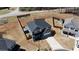 Aerial view of a well-maintained home with a fenced backyard and storage shed at 261 Webster Lake Dr, Temple, GA 30179