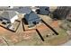 Aerial view of a property with a fenced backyard featuring a pool, patio, and fire pit at 261 Webster Lake Dr, Temple, GA 30179