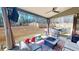 Relaxing covered patio with backyard view, above ground pool, and playset at 261 Webster Lake Dr, Temple, GA 30179
