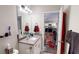 Bathroom features a modern vanity with great lighting, and easy access to other rooms in the home at 261 Webster Lake Dr, Temple, GA 30179