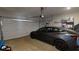 Spacious two-car garage with an automatic door, plenty of shelving, and room for all your automotive and storage needs at 261 Webster Lake Dr, Temple, GA 30179