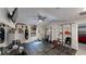 A well-equipped gym with weights, punching bag, a ceiling fan, and a mounted TV at 261 Webster Lake Dr, Temple, GA 30179