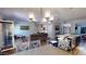 Open-concept kitchen with an island, stainless steel appliances, and adjacent living area, great for entertaining at 261 Webster Lake Dr, Temple, GA 30179